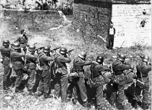 Georges Blind, a member of the French resistance, smiling at a German firing squad, October 1944..jpg