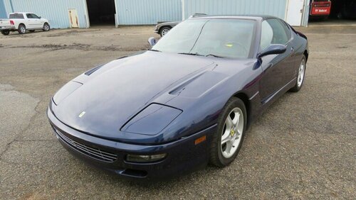 The Ferrari 456 GT is a 2+2 coupe with a top speed of 186 mph.jpg